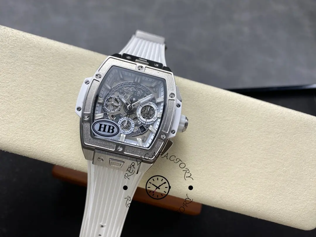 Another angle of Hublot 642.NE.2010.RW showing the dial and strap against a cushion.