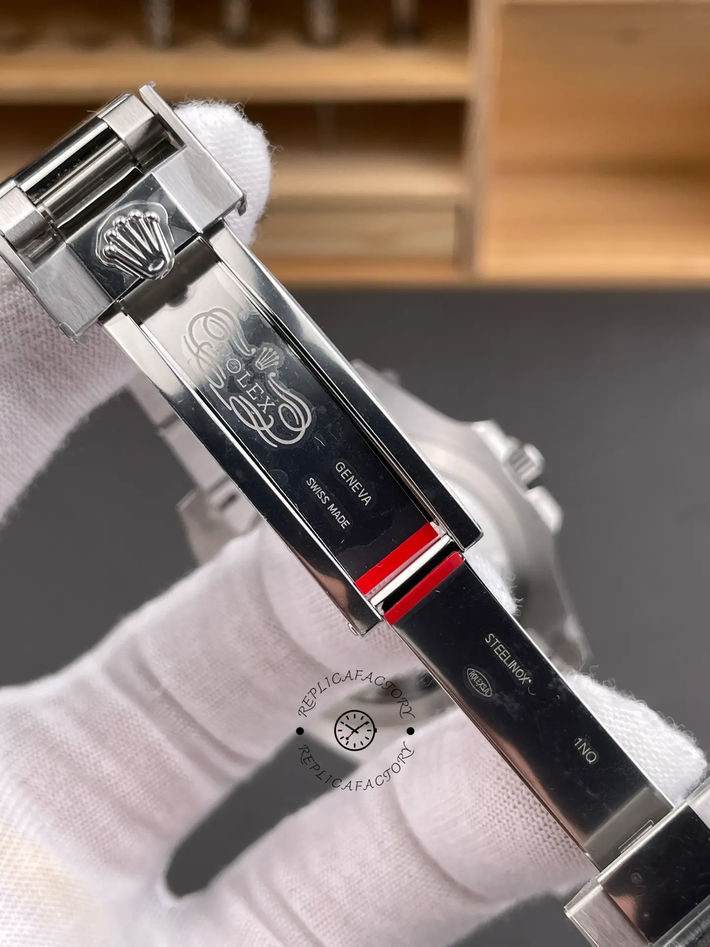 Inside clasp view of Rolex GMT-Master II 116710BLNR showing engraved clasp details and polished surfaces.