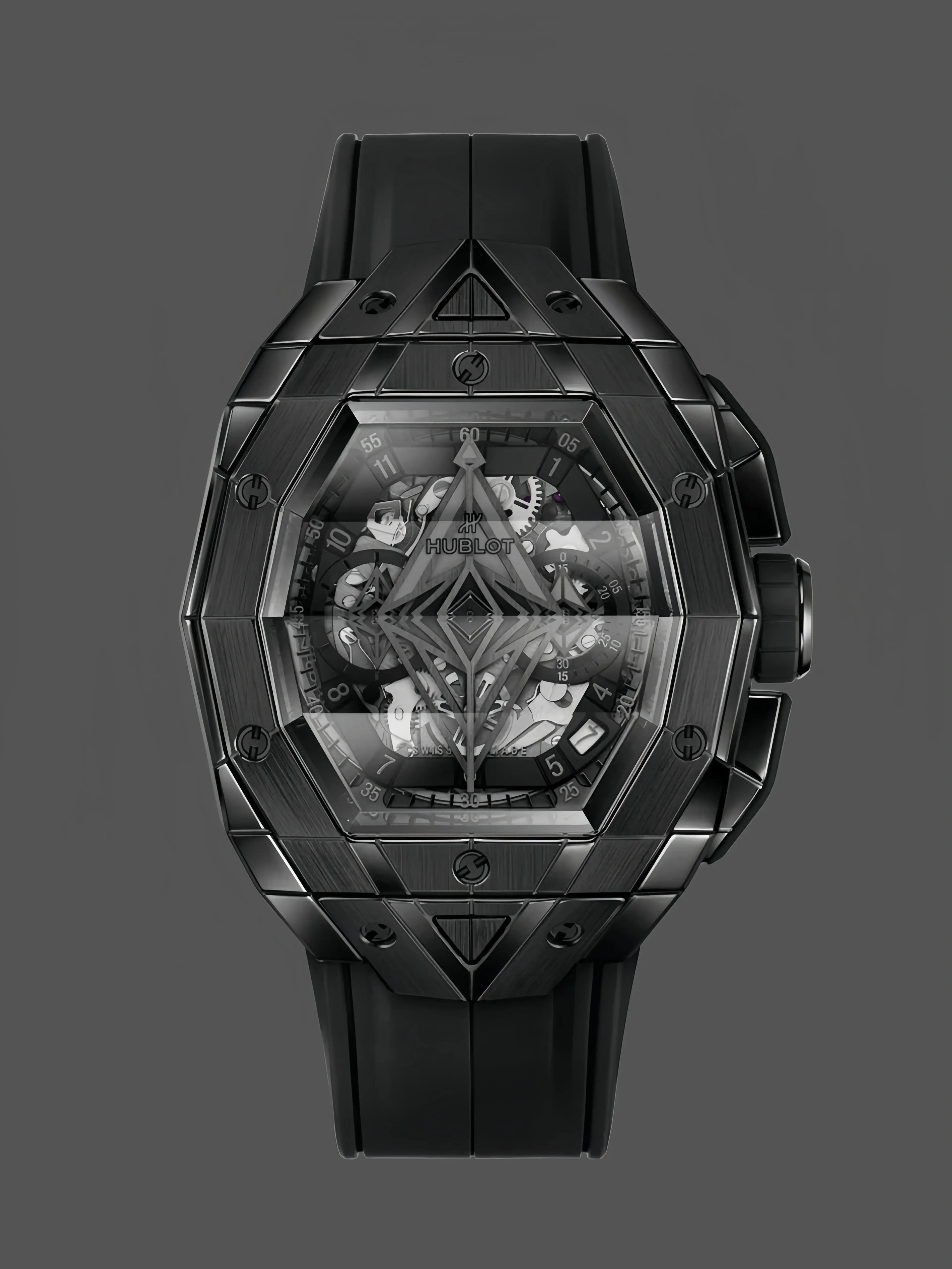 Front view of Hublot 648.CX.0114.RX.MXM23 showing black faceted case, skeleton chronograph dial, and rubber strap. - Front view