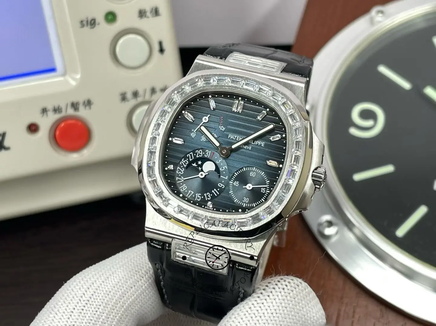 Front angled view of Patek Philippe Nautilus 5724G 001 showing baguette diamond bezel.