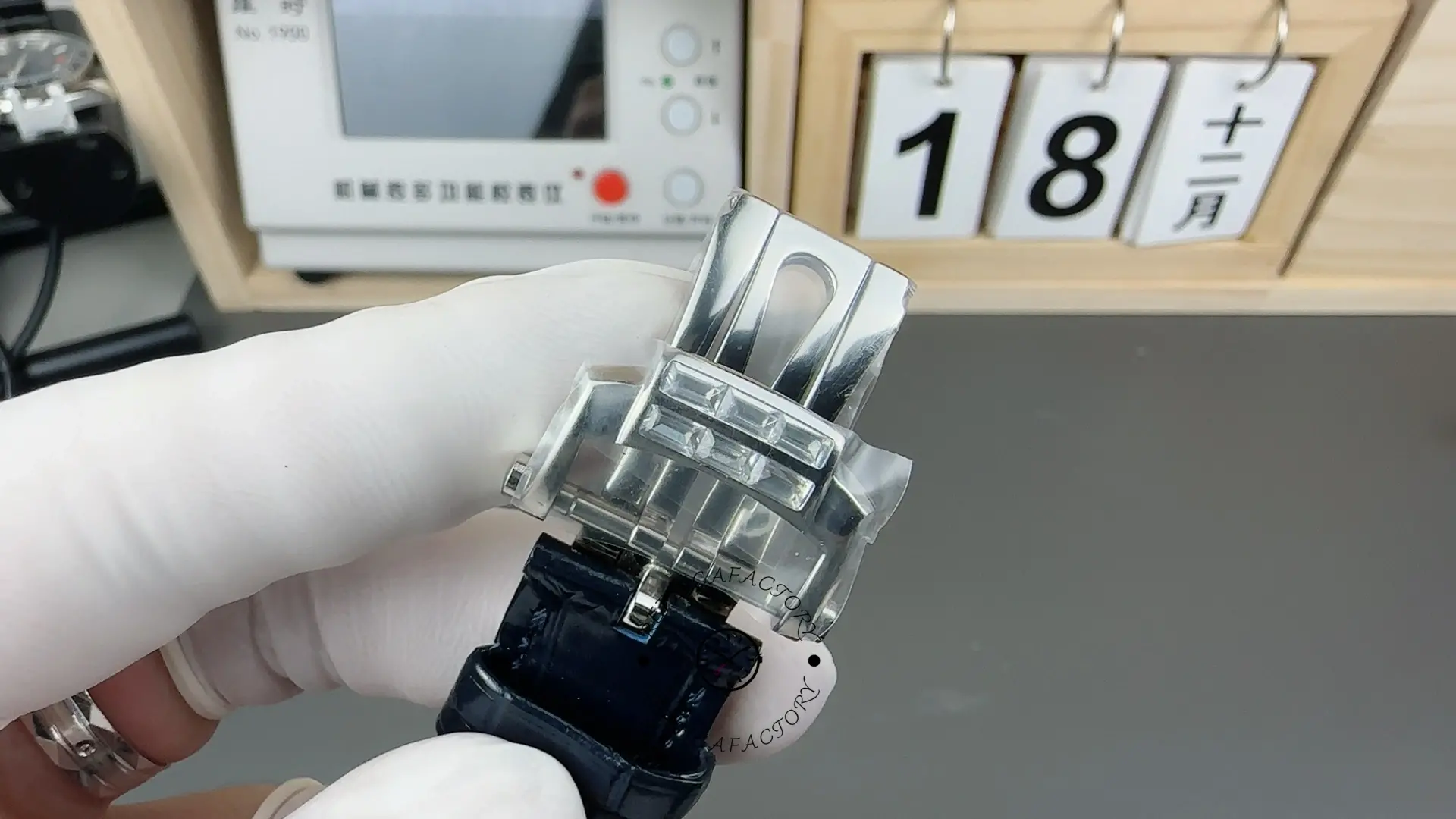 Bracelet link view of Patek Philippe Nautilus 5724G-001 showing clasp and strap attachment.