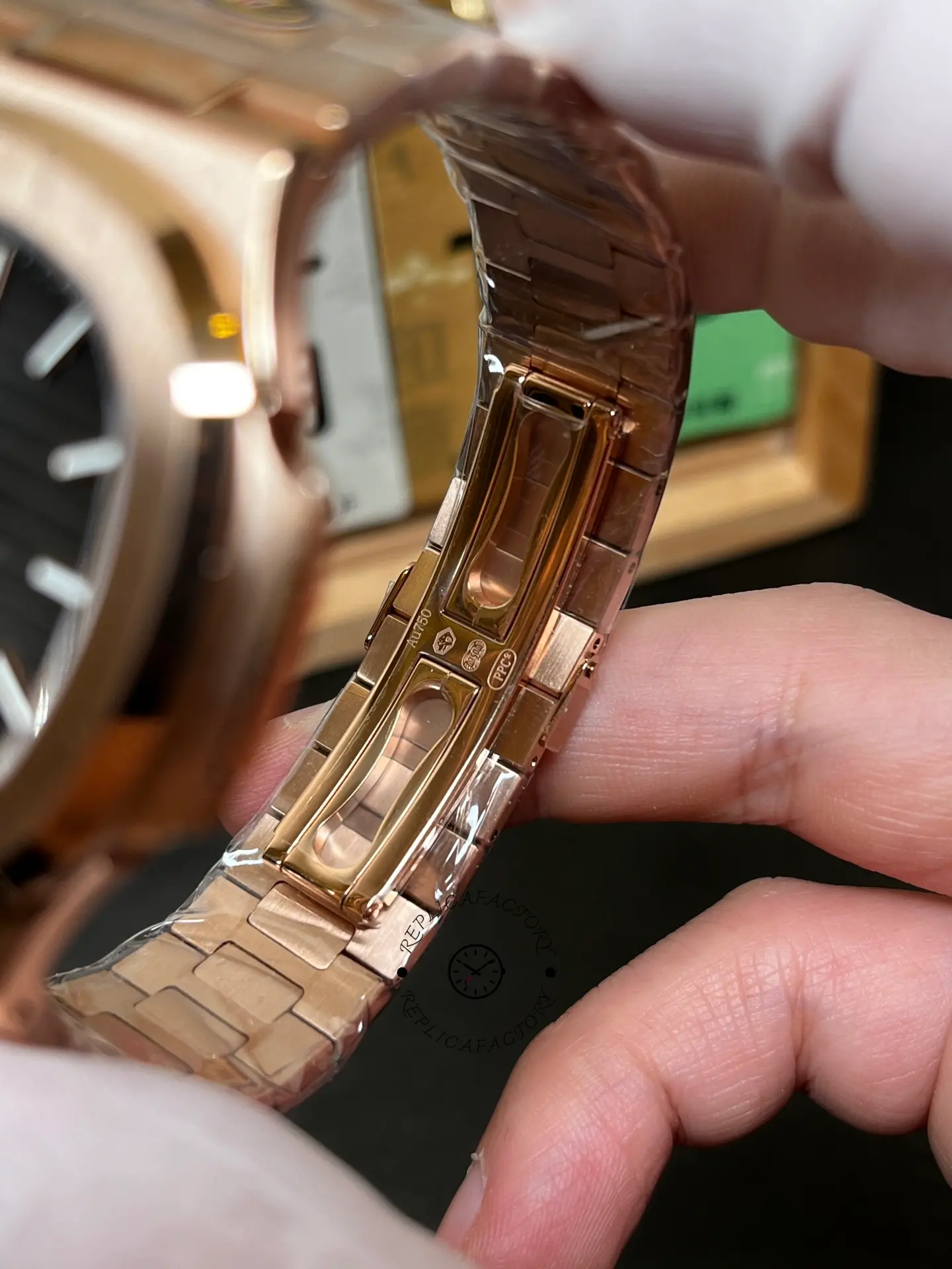 Macro view of the 5711 1R 001 clasp interior, highlighting hallmarks and the deployant locking mechanism.