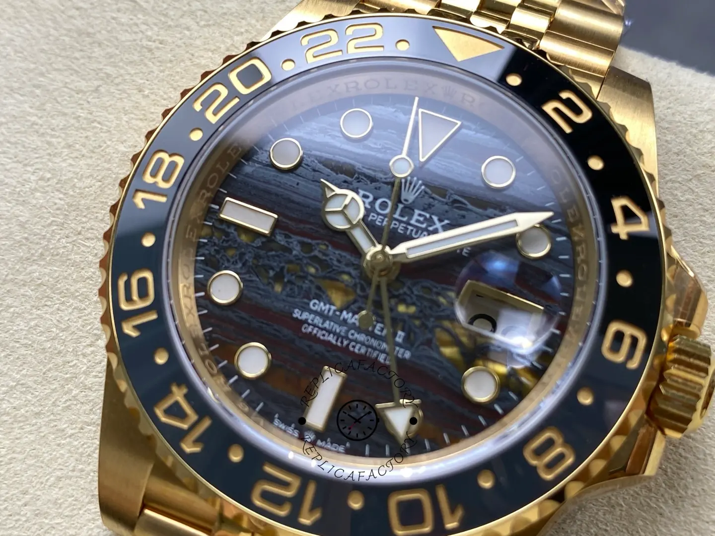 Rolex GMT-Master II yellow gold dial detail luminous markers cyclops