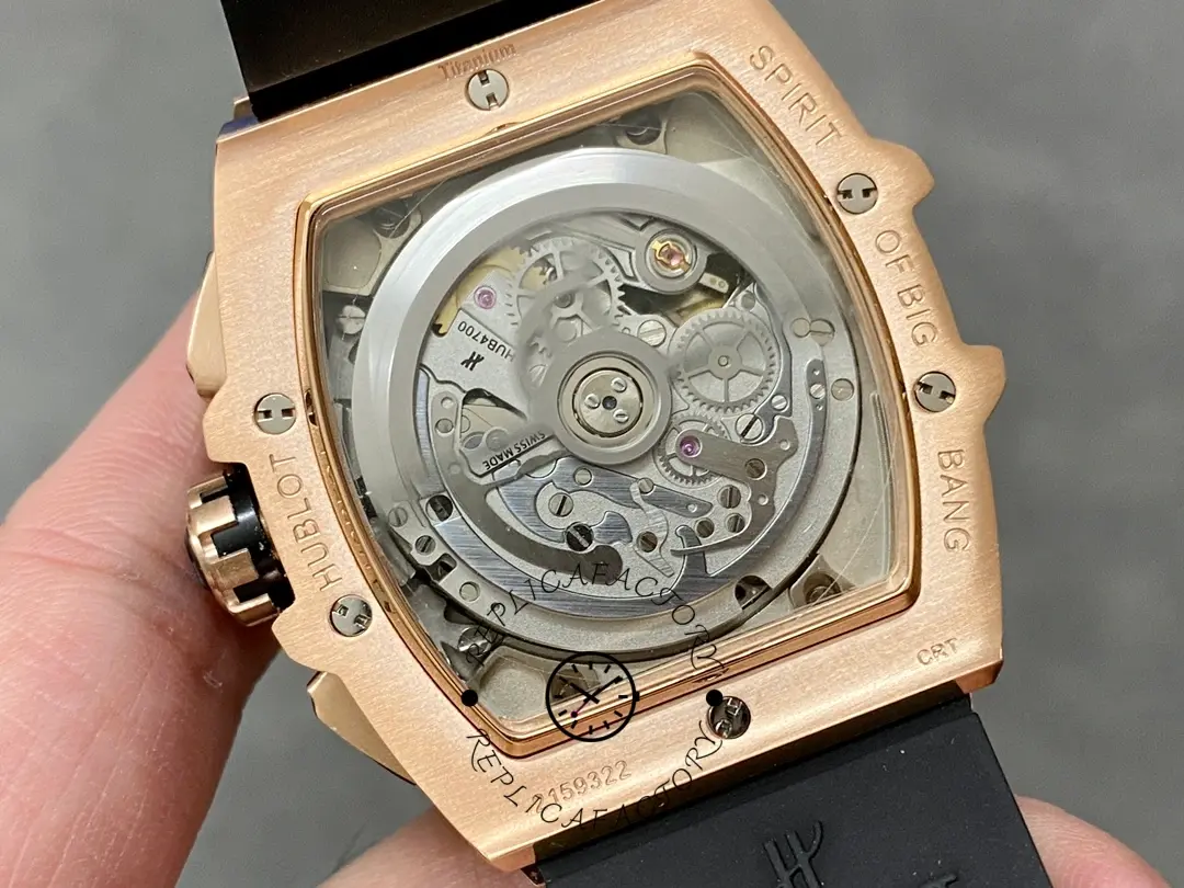 Exhibition caseback of Hublot 642.OM.0180.RX showing rotor and visible gears through sapphire back.
