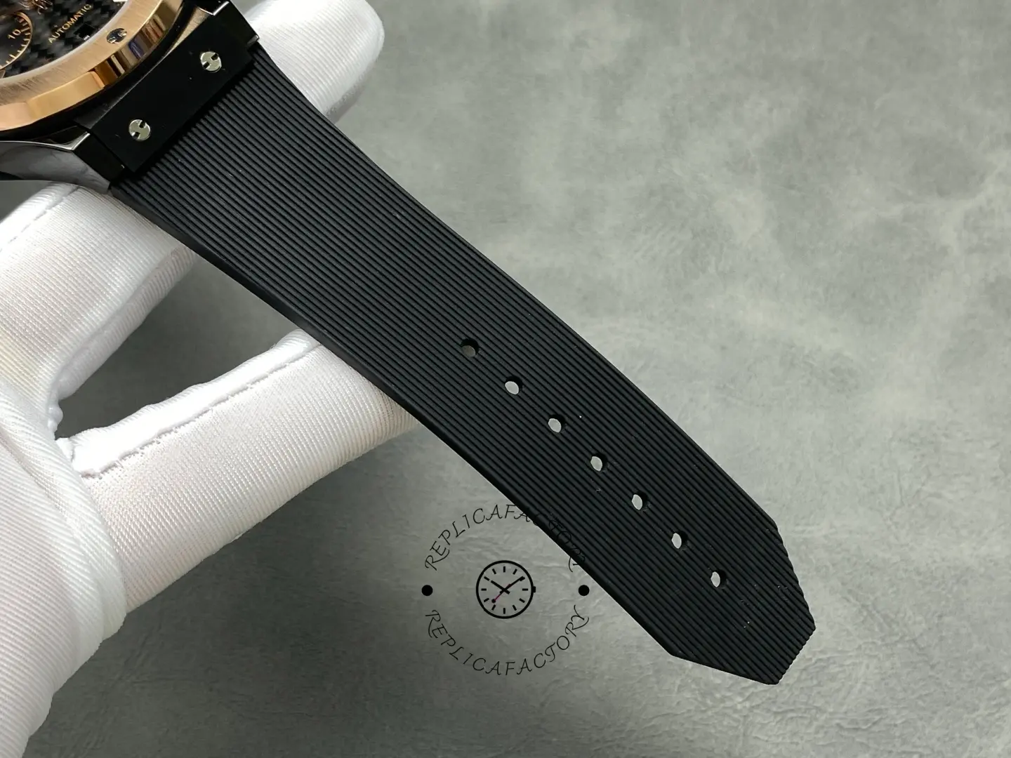 Strap detail of Hublot Classic Fusion 521.CO.1781.RX showing black strap and holes.