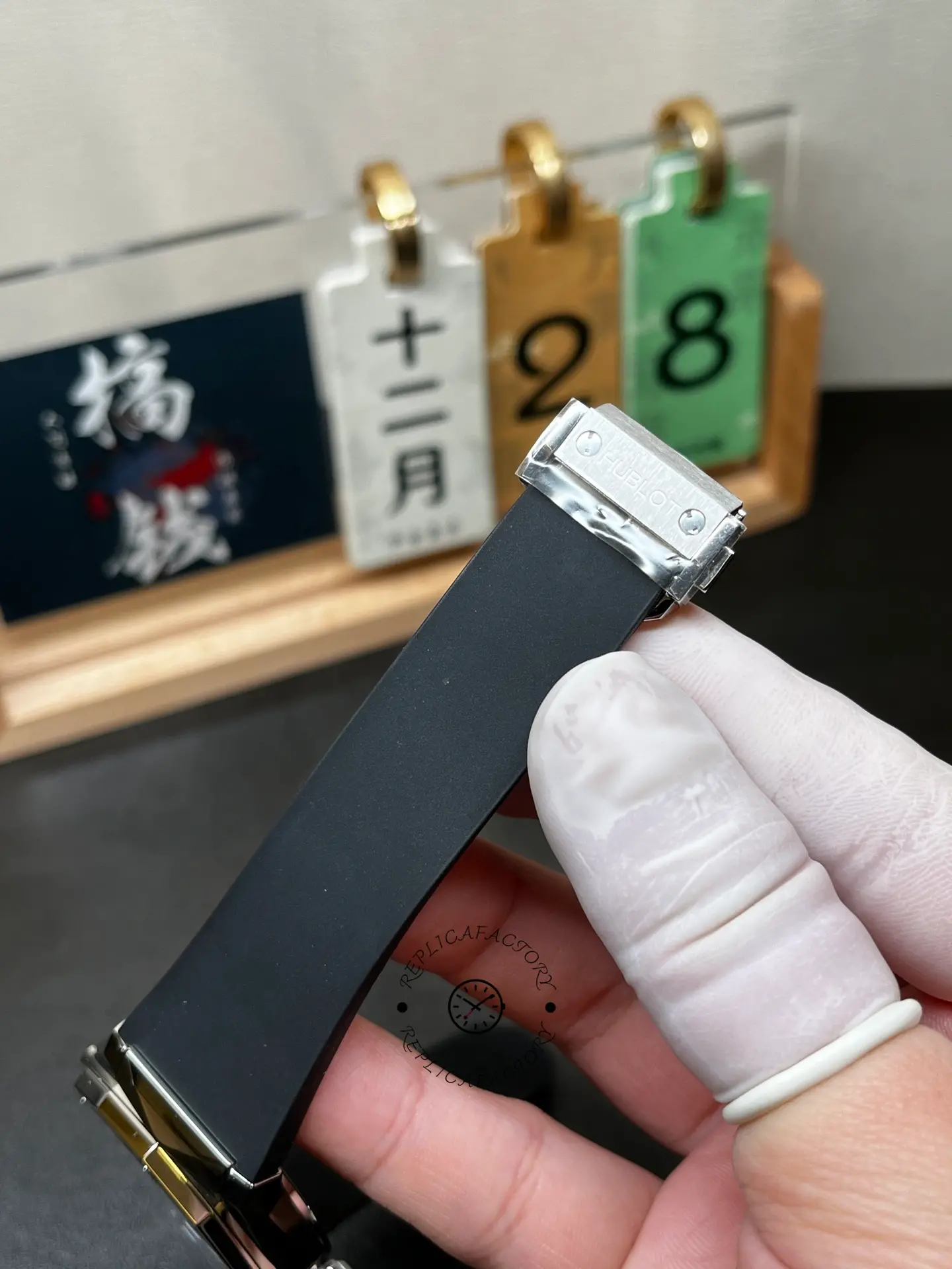 Hublot Classic Fusion Orlinski 550.NS.1800.RX.ORL19 strap and clasp area, black rubber texture.