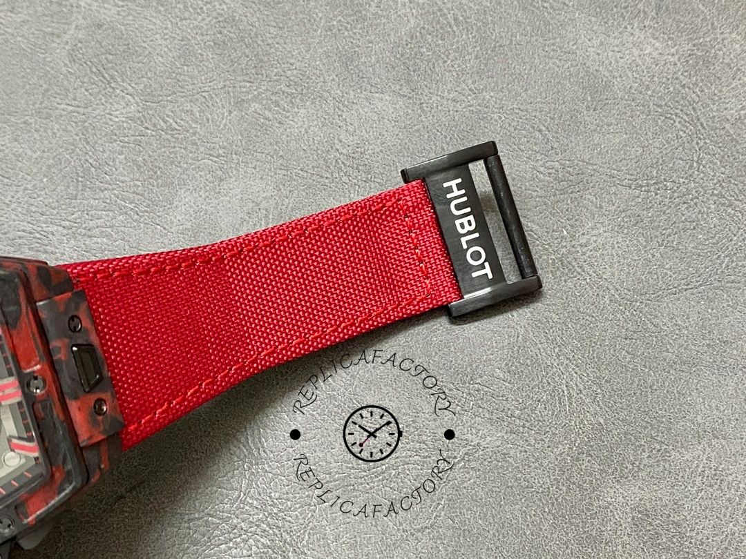 Hublot Big Bang 642.QV.0113.NR.CNY21 strap close-up showing red fabric texture and buckle end.