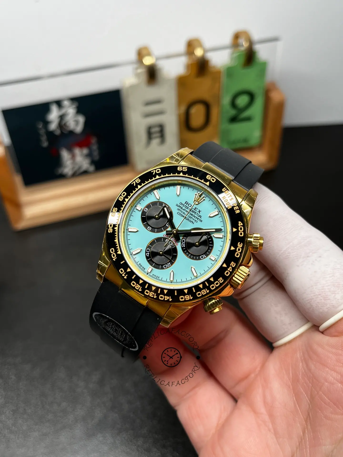Angled front shot of Rolex Daytona 126518LN-0014 showing turquoise dial depth and tachymeter markings.