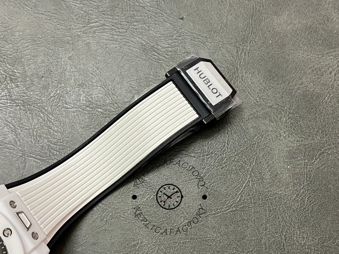 Strap end detail of Hublot Big Bang Unico 411.HX.1171.RX showing the white rubber strap and attachment.
