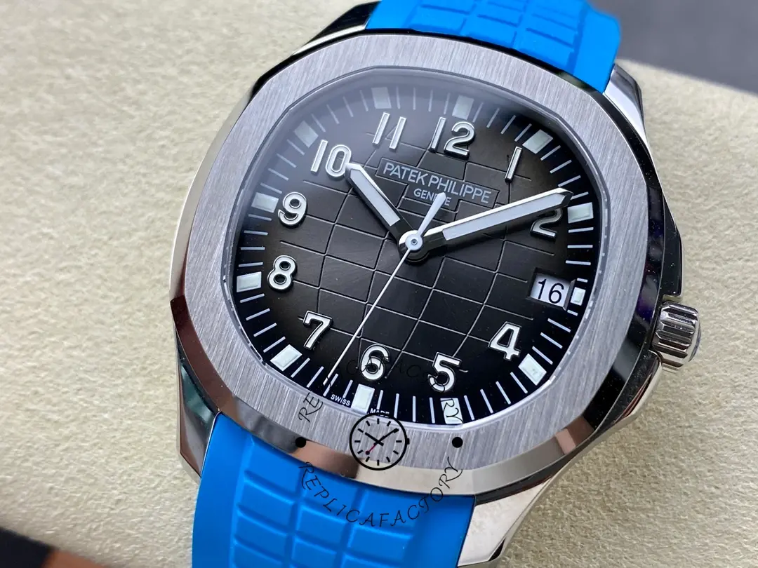 Angled close-up of Patek Philippe Aquanaut 5167A-001 highlighting luminous hands and Arabic numerals.