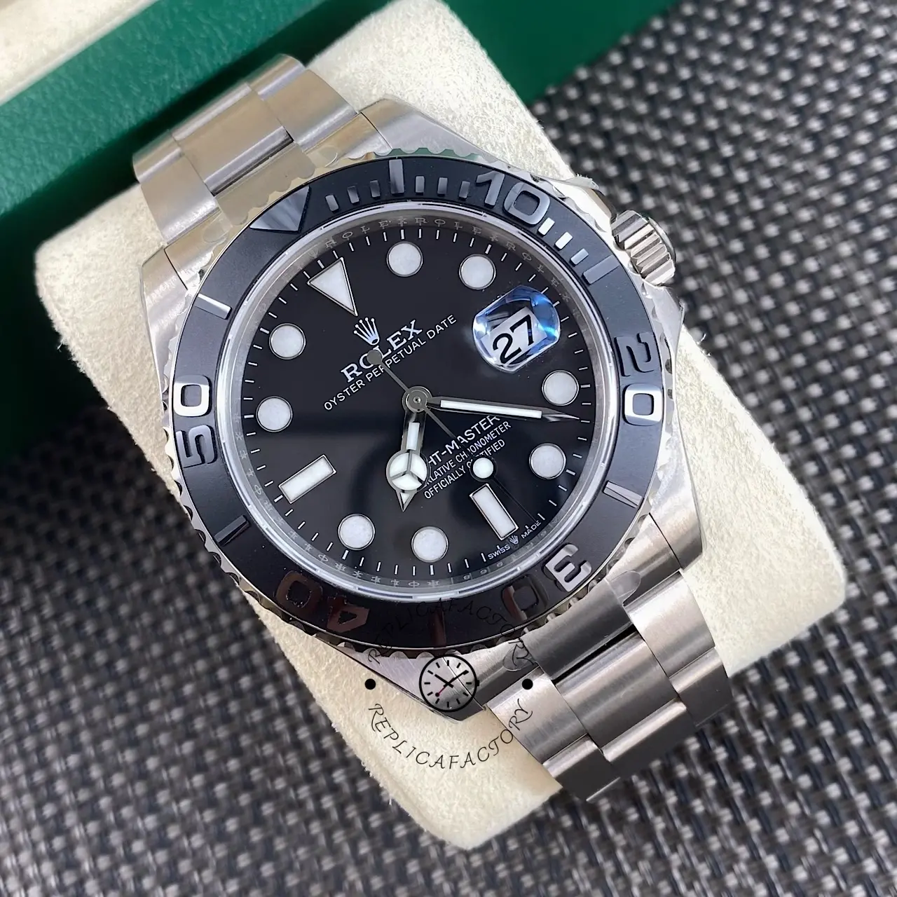 Angled front view of Rolex Yacht-Master 226627-0001 on cushion with black dial and matte bezel.