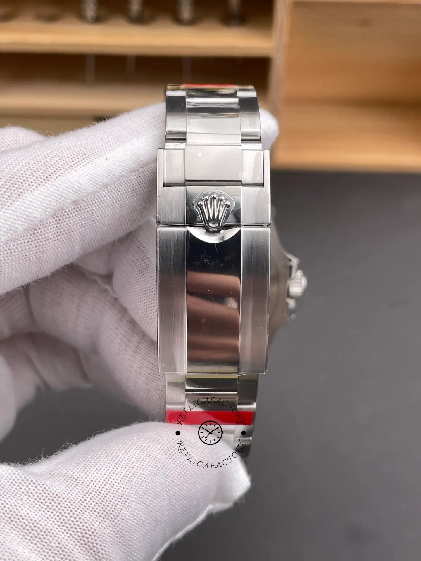 Closed clasp rear view of Rolex GMT-Master II 116710BLNR Oyster bracelet with Rolex crown logo.