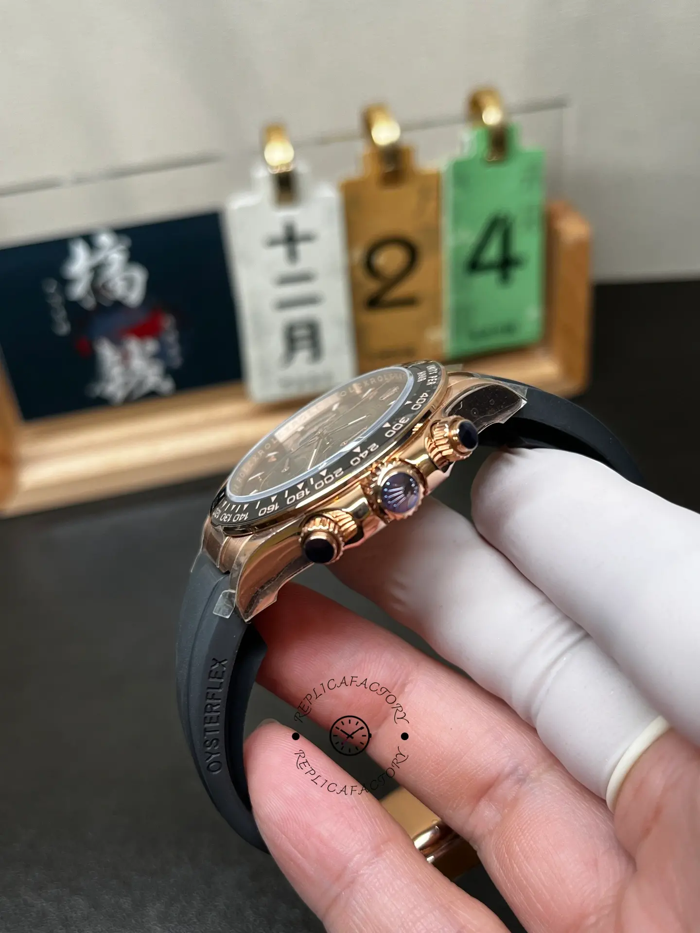 Crown-side angle of Rolex 126515LN-0010 showing chronograph pushers, rose gold-style case and ceramic bezel.