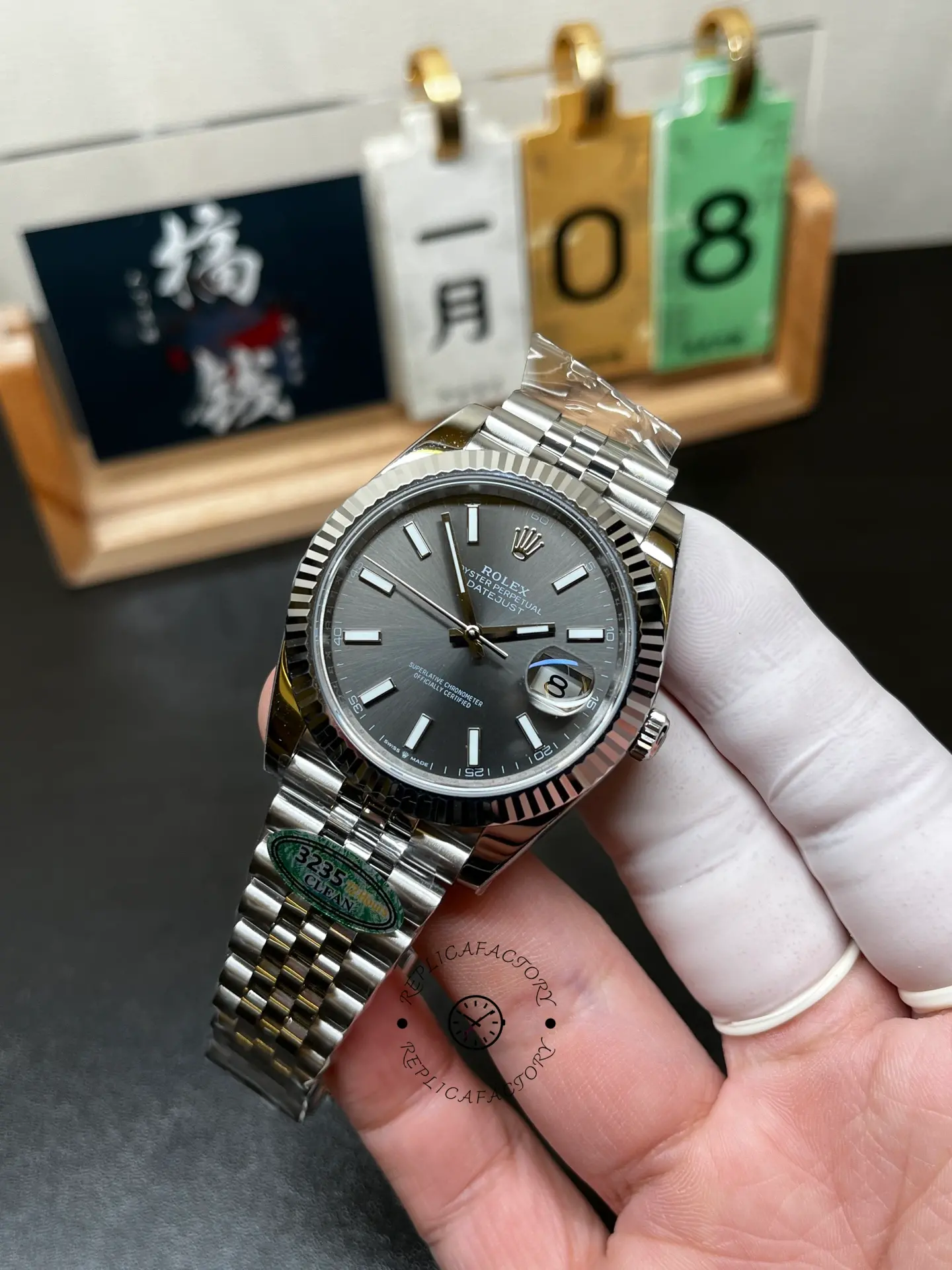 Angled front view of Rolex Datejust 126334-0014 with grey sunray dial, fluted bezel and Cyclops date lens.