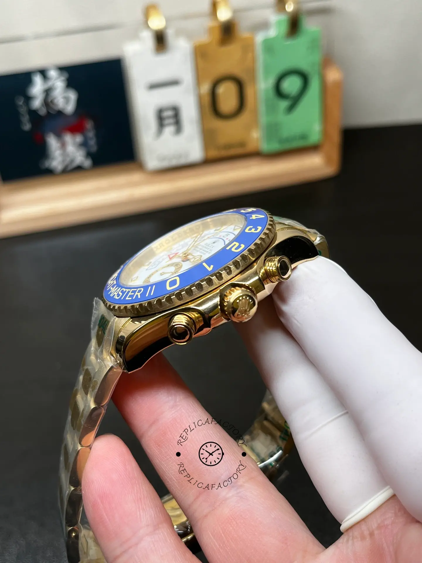 Side view of Rolex Yacht-Master II 116688 showing crown, pushers and blue bezel profile.