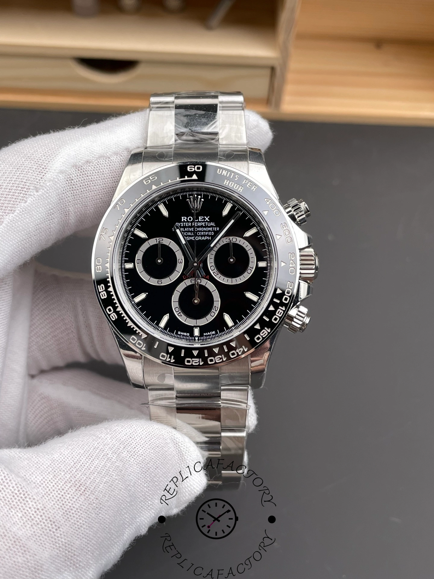 Front view of Rolex Cosmograph Daytona m126500LN-0002 with black dial and ceramic tachymeter bezel.