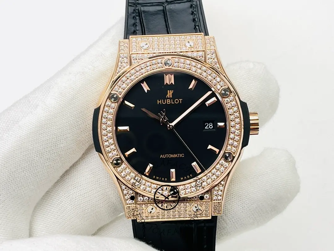 Hublot Classic Fusion 542.OX.1181.LR.1704 front view on glove, black dial with rose gold case.