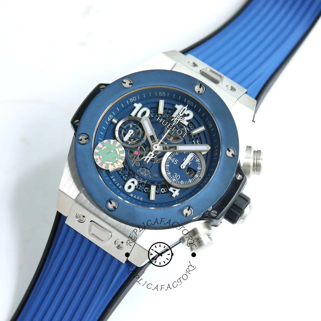 Three-quarter view of Hublot Big Bang 421.NL.5170.RX showing the blue rubber strap and openworked dial.