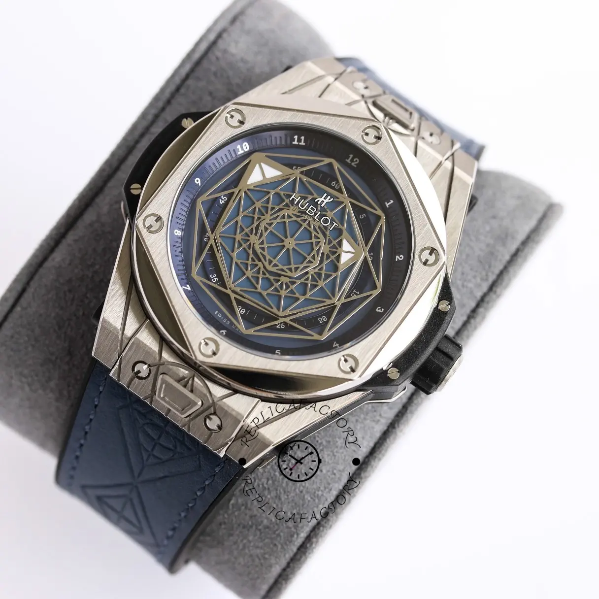 Three-quarter view of Hublot Big Bang 415.NX.1112.VR.MXM16 blue dial on strap, resting on cushion.