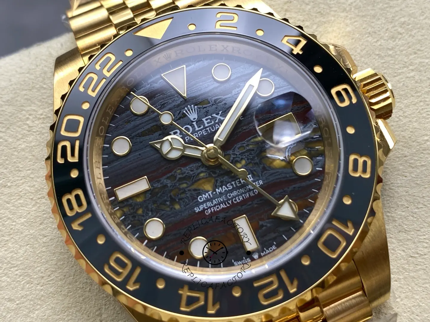 Rolex GMT-Master II 126718GRNR close-up tiger iron dial black grey bezel