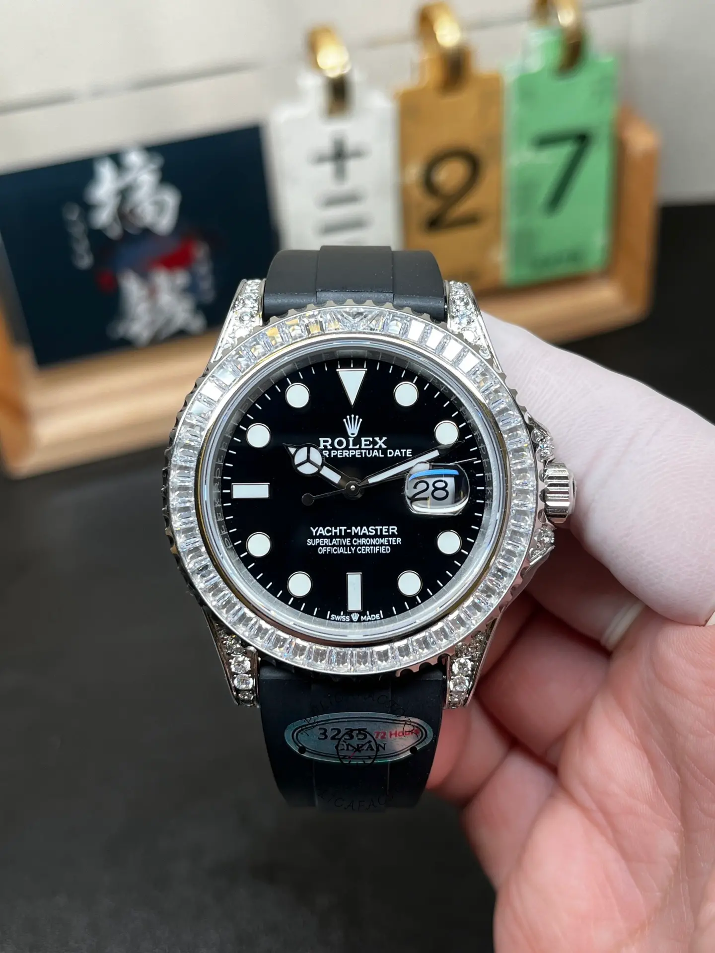 Front view of Rolex Yacht-Master 42 226679TBR with black dial, baguette bezel and black Oysterflex strap.