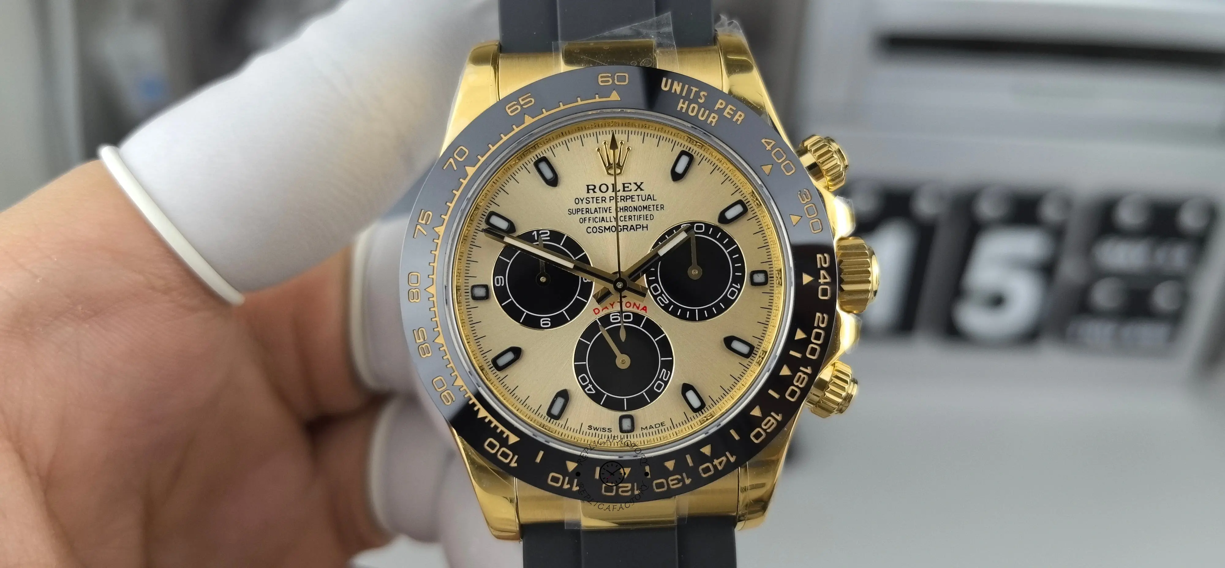 Straight front view of Rolex Daytona 116518LN showing champagne dial and black ceramic bezel.