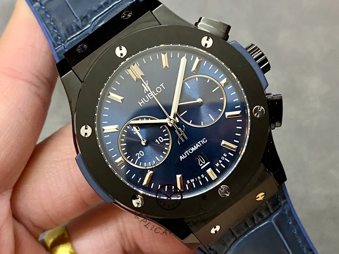 Angled front view of Hublot 521.CM.7170.LR showing chronograph pushers and blue strap integration.