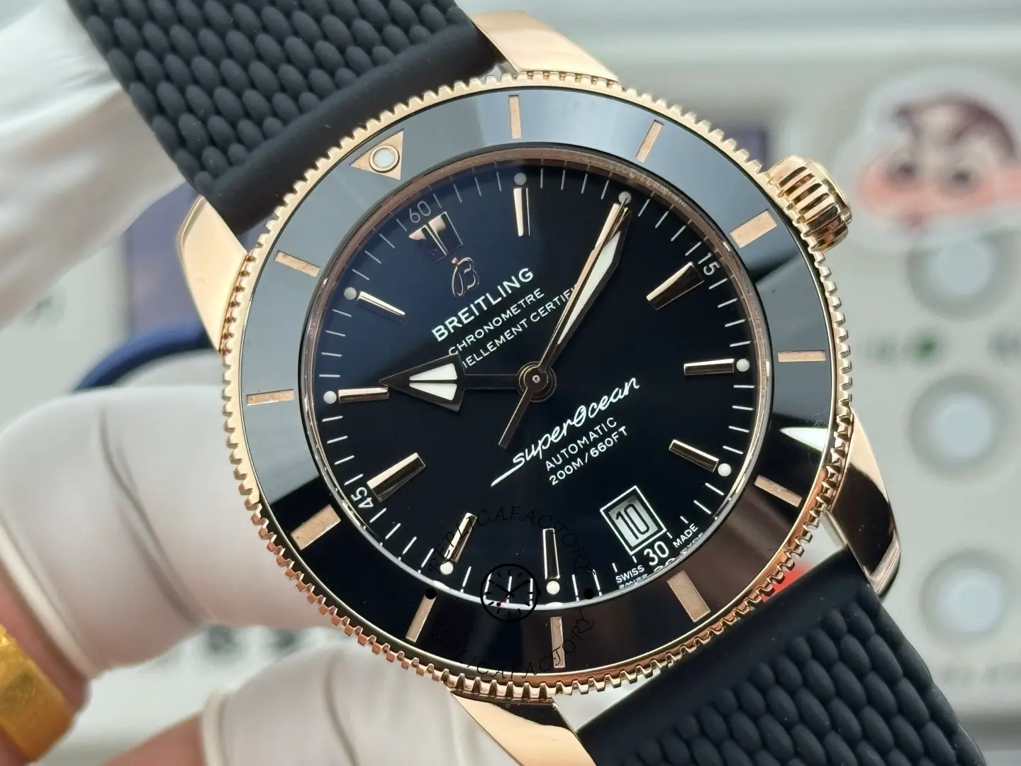 Breitling RB2010121B1S1, front view showing black mesh-style strap and rose-gold case.