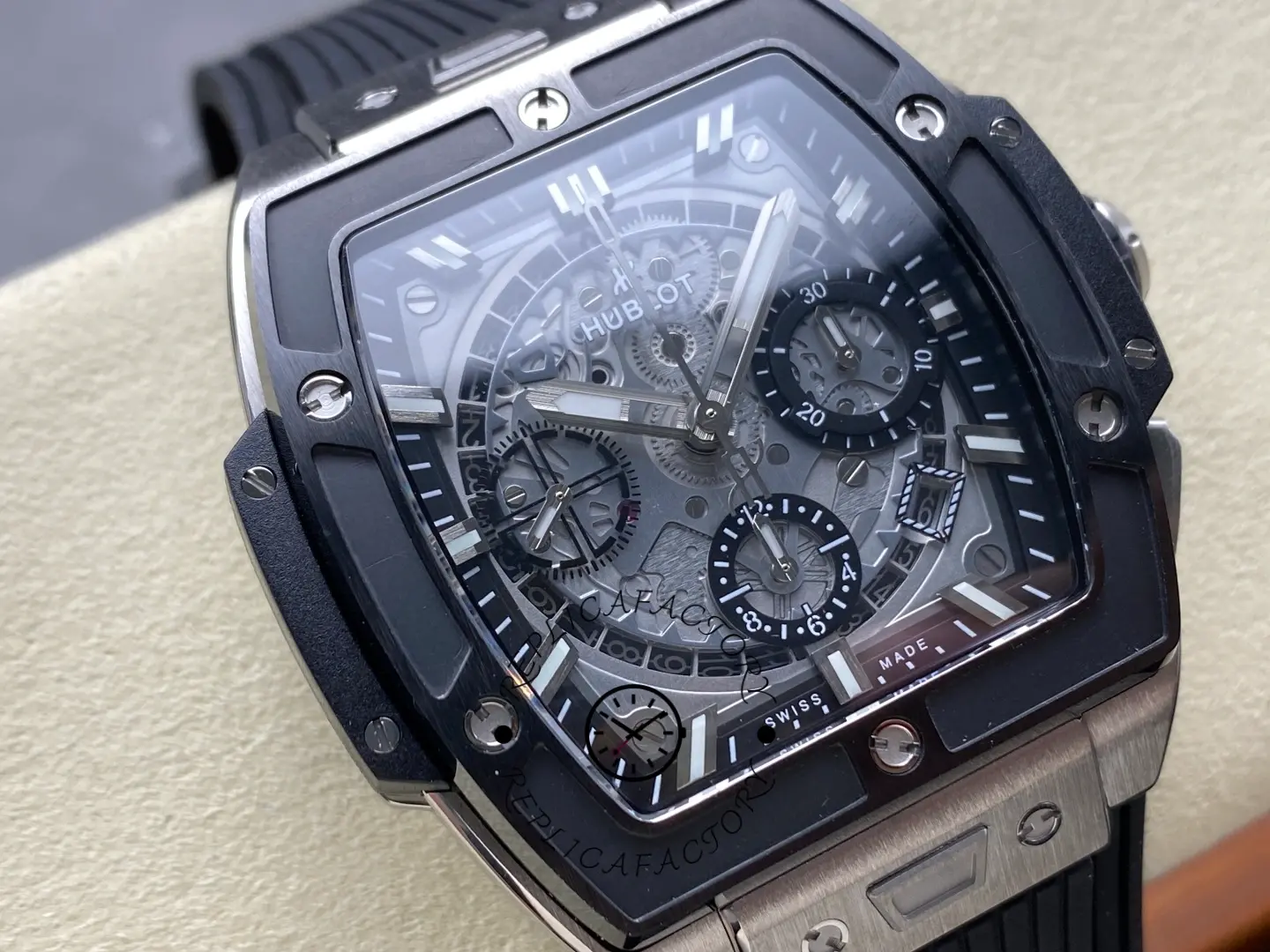 On-cushion wrist-style shot of Hublot 642.NM.0170.RX highlighting tonneau case and skeleton dial.