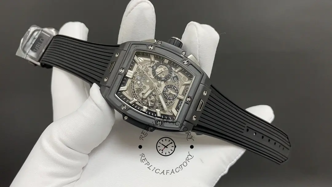 Side angle of Hublot 642.CI.0170.RX in gloved hand showing strap integration at lugs.
