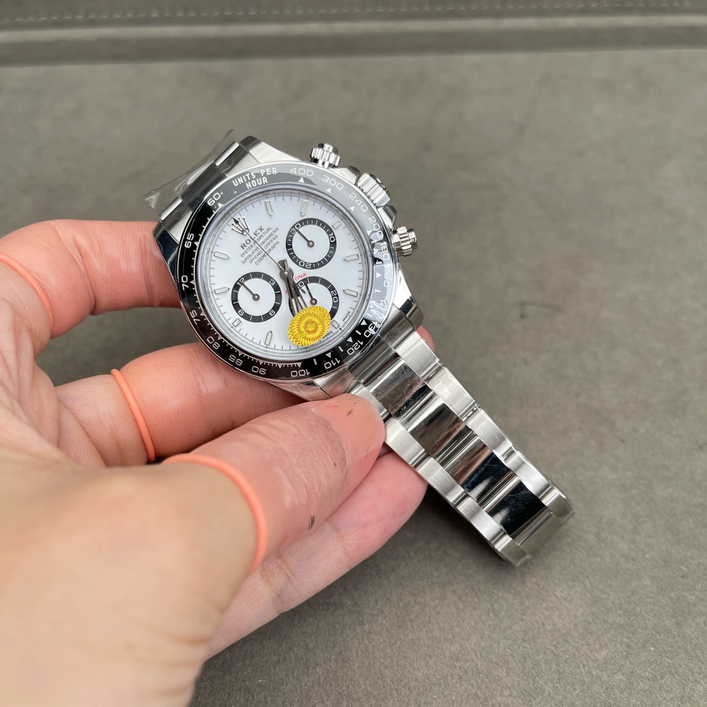 Stainless steel watch in an angled view showing polished and brushed surfaces