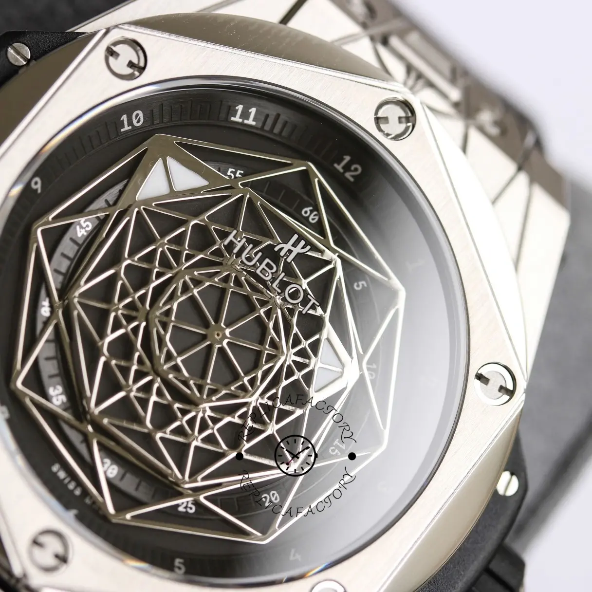 Macro of Hublot Big Bang 415.NX.1112.VR.MXM16 dial, showing the geometric openworked motif.