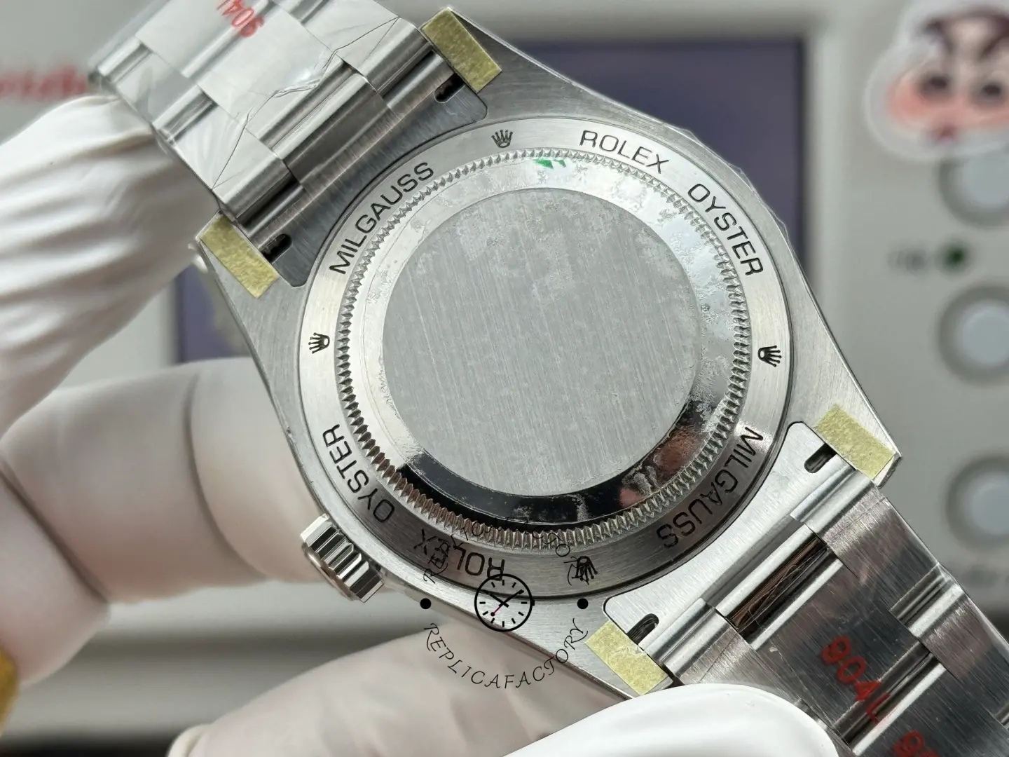 Caseback view of Rolex Milgauss 116400GV-0002 showing engraved back and brushed steel bracelet.