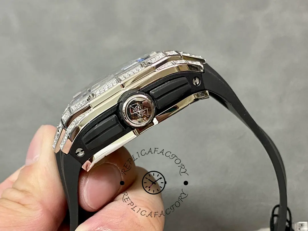 Side profile of Hublot 648.NX.0107.RX.1604.MXM23 showing crown detail and layered case construction.