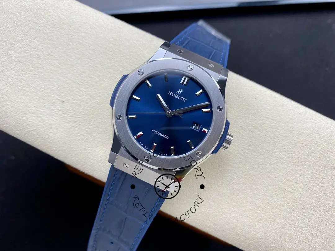 Angled view of Hublot Classic Fusion 542.NX.7170.LR laid on box showing blue dial and bezel screws.