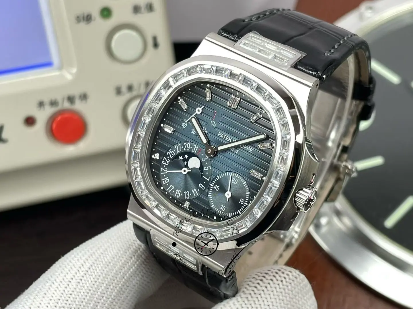 Detailed dial view of Patek Philippe Nautilus 5724G 001 with calendar and sub-dials.