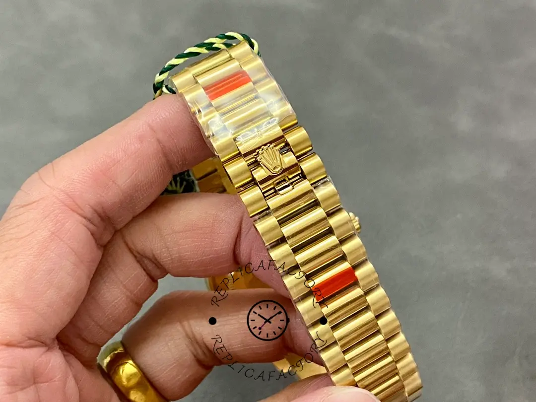 Handheld bracelet view of Rolex 228238-0061 showing President links from the side.