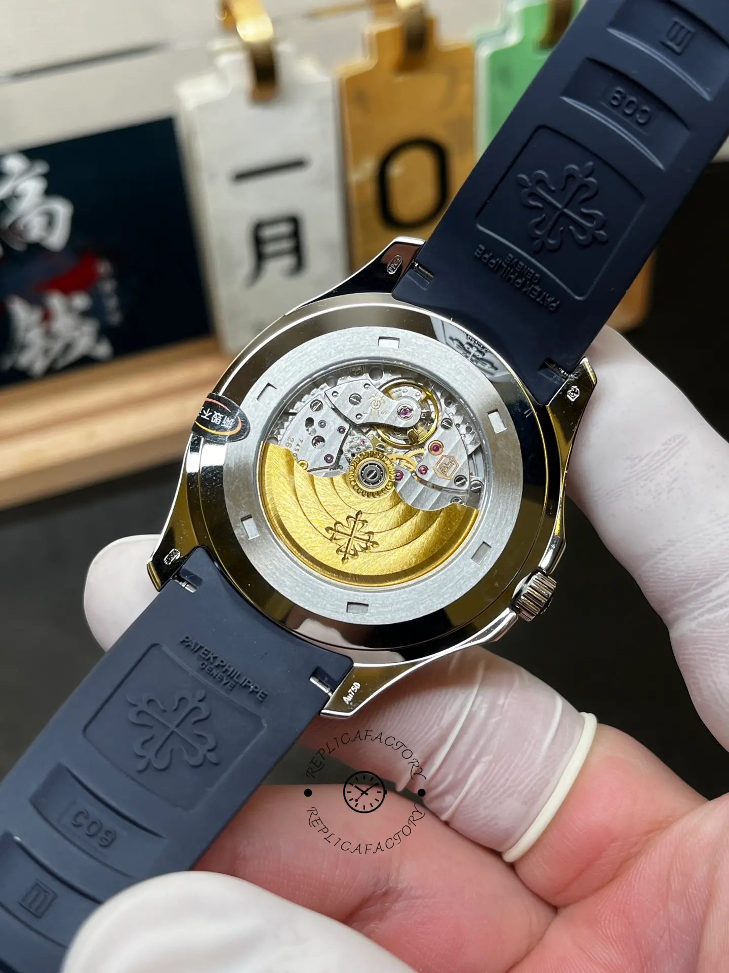 Exhibition caseback of Patek Philippe Aquanaut 5168G-001 showing gold rotor and movement finishing.