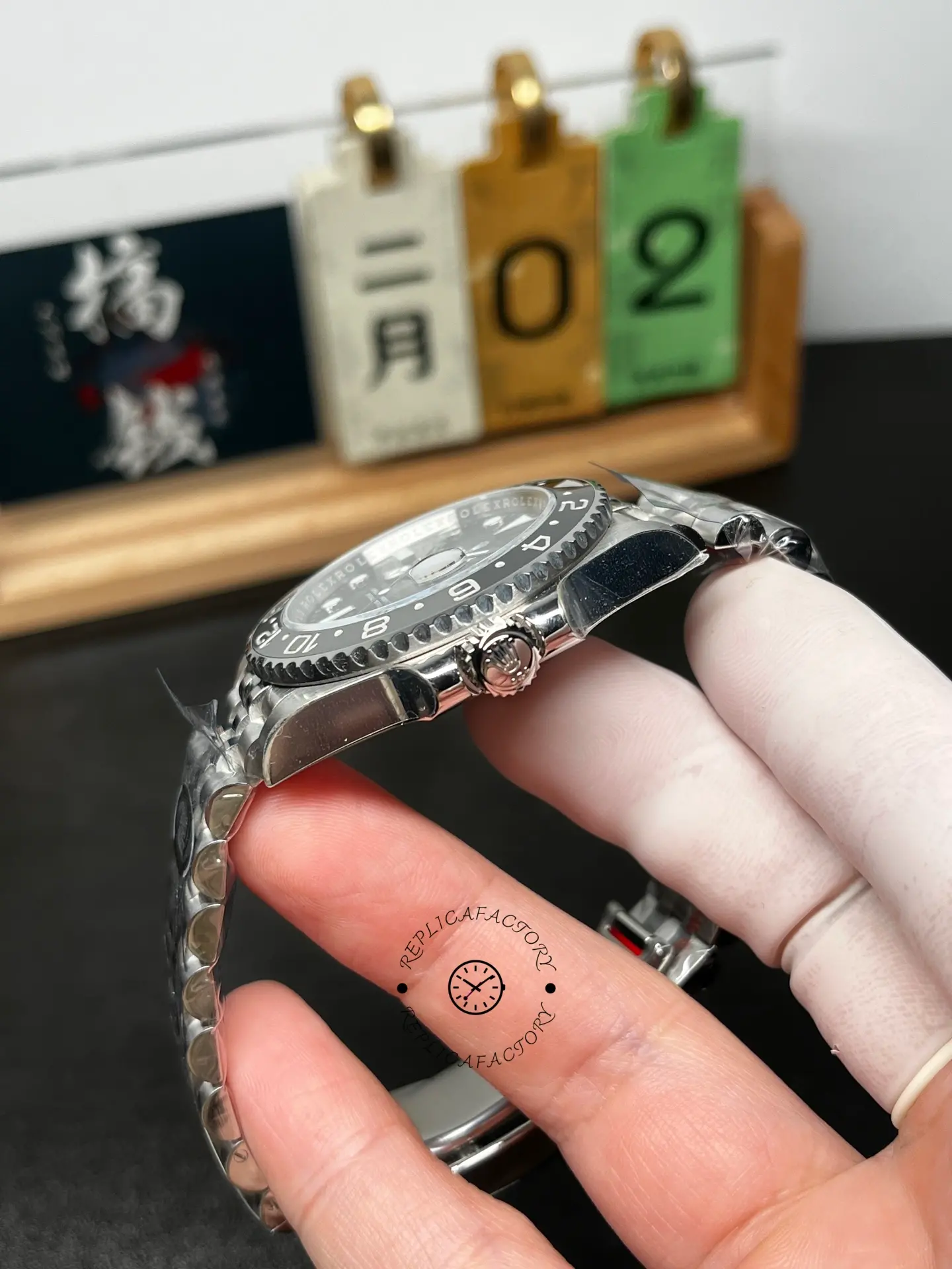 Side profile of Rolex GMT-Master II M126710GRNR-0003 showing screw-down crown and ceramic bezel edge.