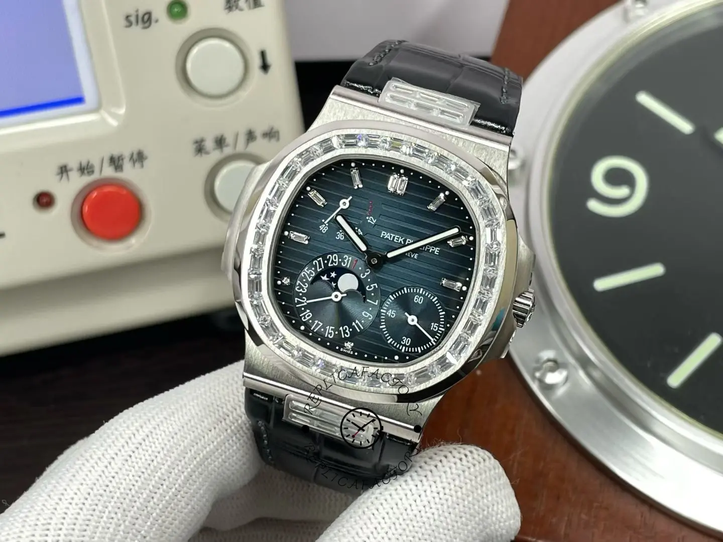 Front view of Patek Philippe Nautilus 5724G 001 with black dial and moon phase complication.