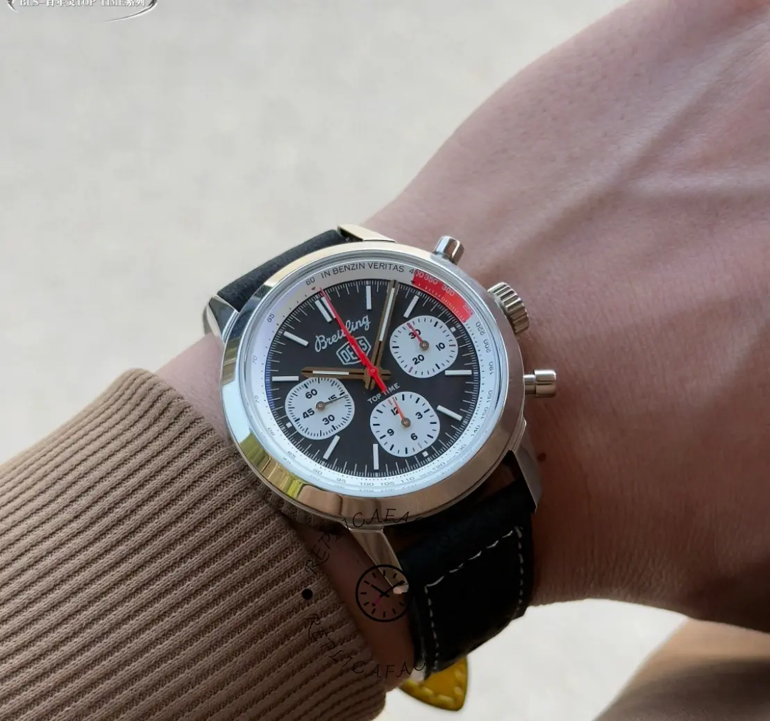 Breitling Top Time B01 Deus Chronograph AB01765A1B1X1, wrist shot showing black strap and lugs.