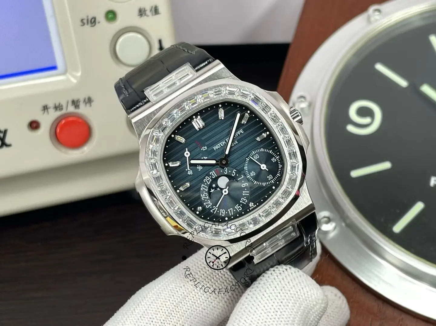 Close-up front view of Patek Philippe Nautilus 5724G 001 highlighting moon phase display.