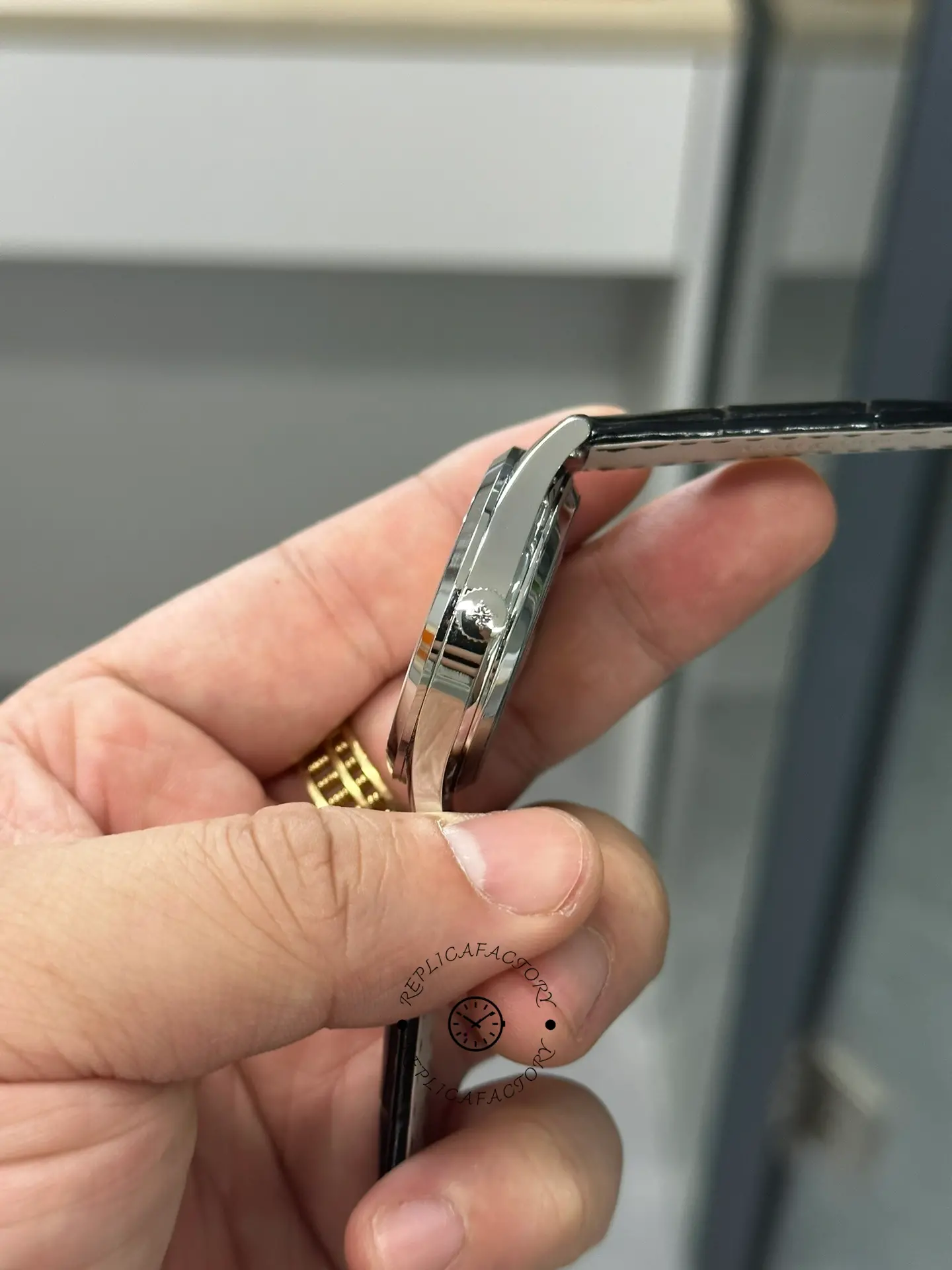 Side profile of Patek Philippe Calatrava 5196G-001 showing case thickness and crown position.