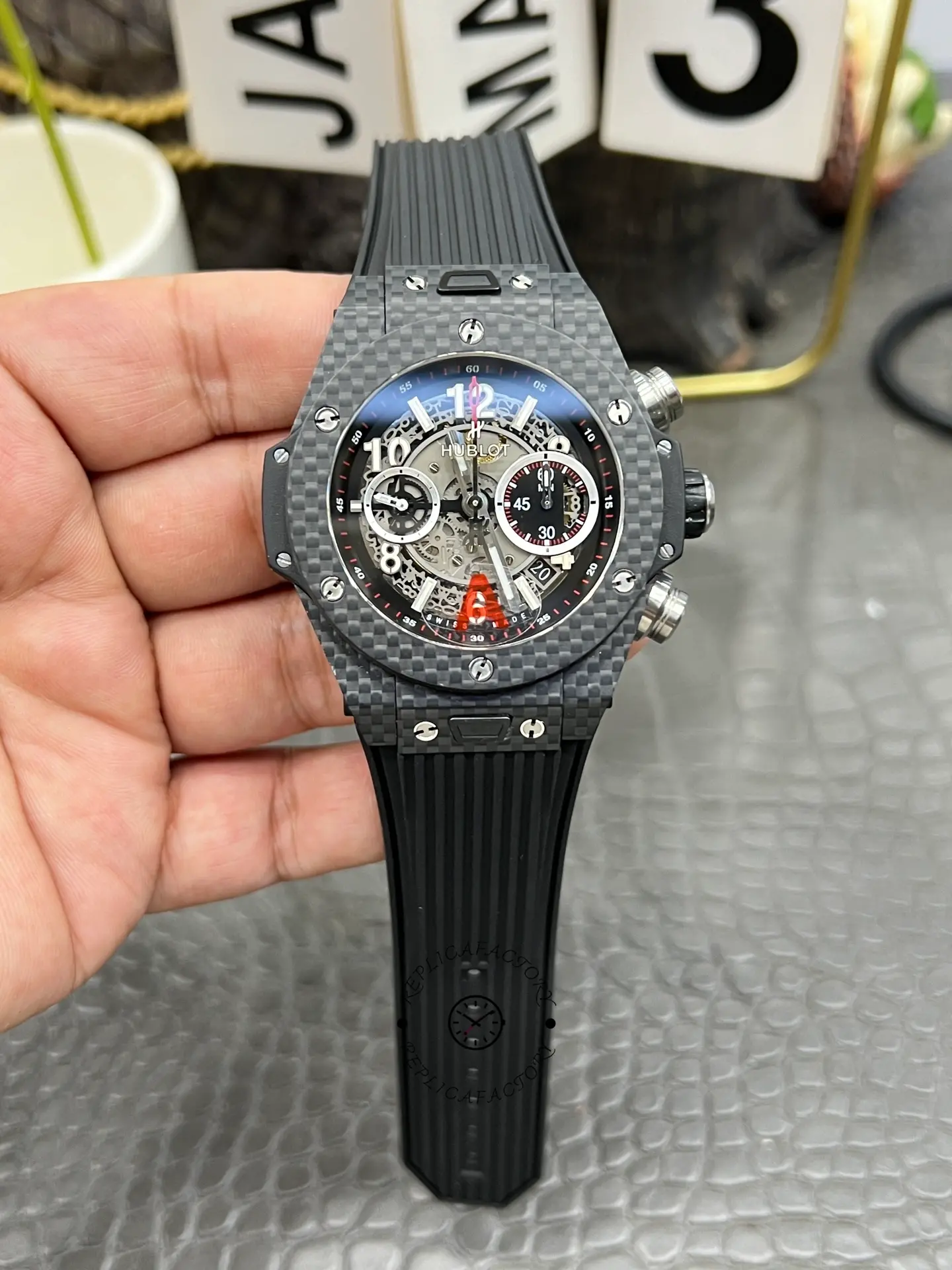 Hublot Big Bang UNICO 411.QX.1170.RX front close-up, carbon bezel and chronograph subdials.