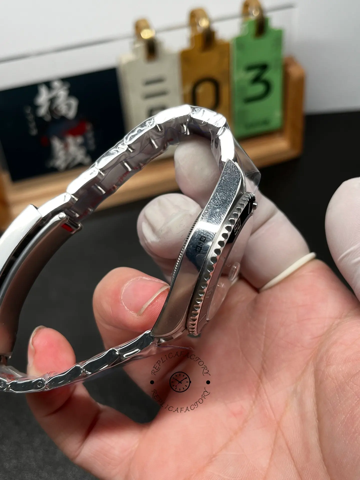 Case side profile of Rolex Submariner 126610LN 0001 showing polished flank and bezel overhang.