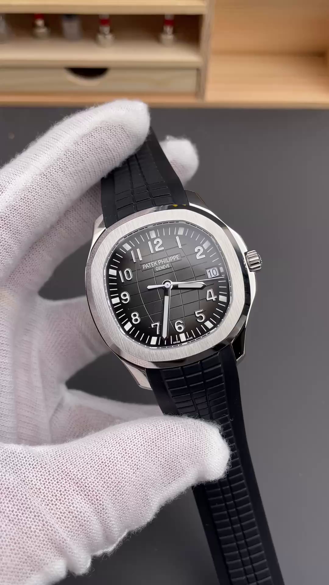 Video: hand-held Patek Philippe Aquanaut 5167A-001 showing case finish and black rubber strap. - Video