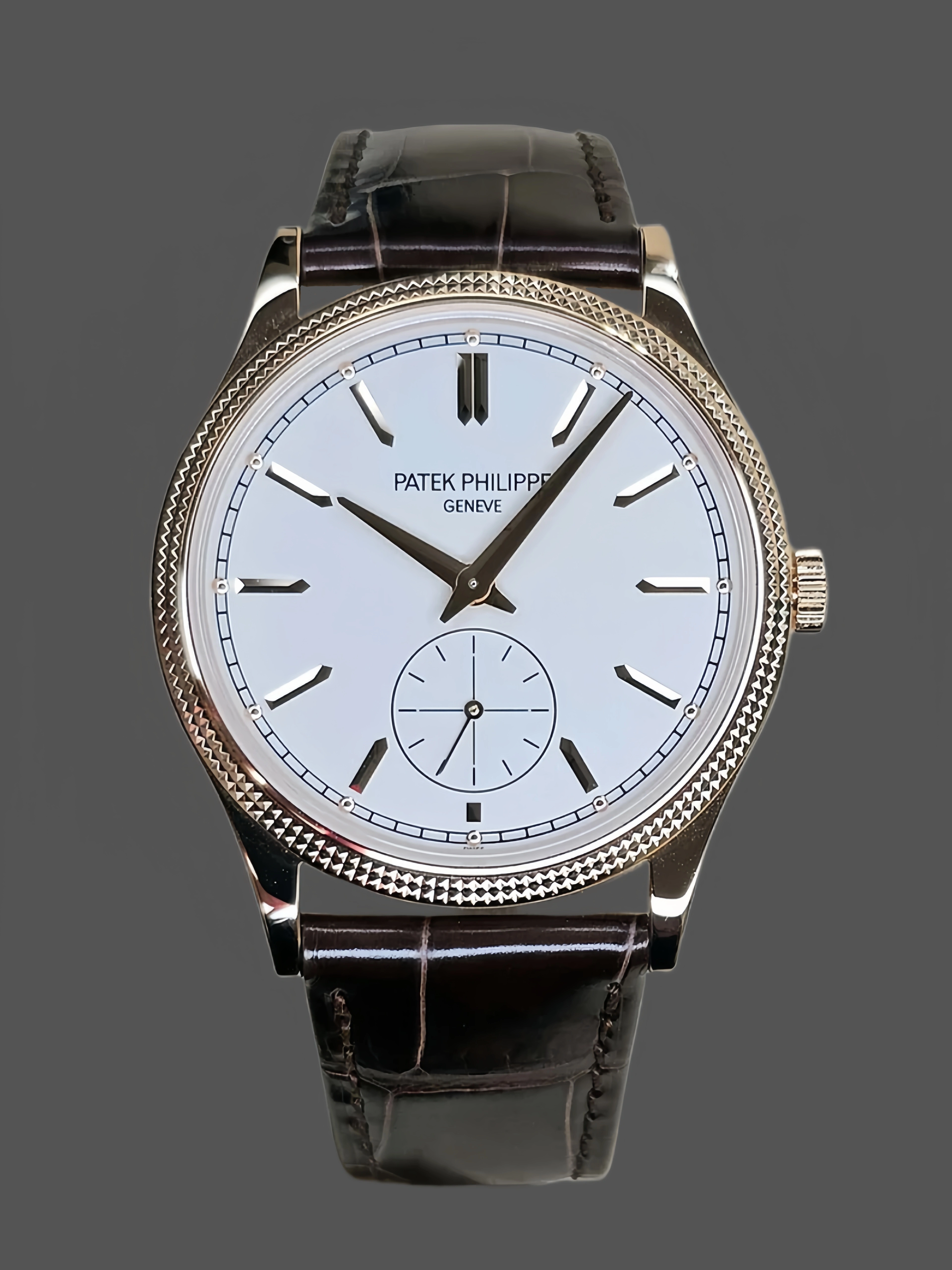 Front view of Patek Philippe Calatrava 6119R-001, white dial with small seconds and brown leather strap. - Front view