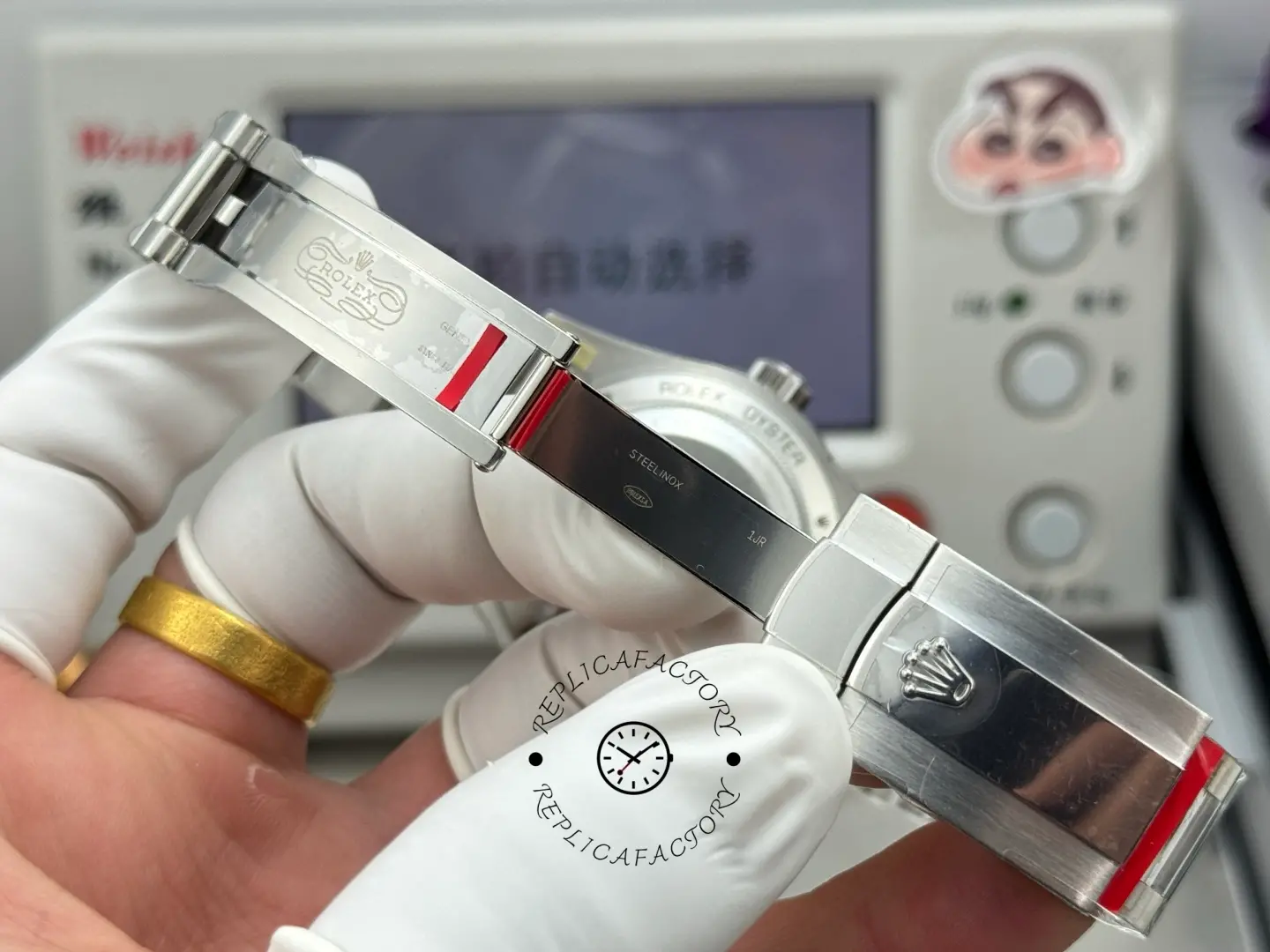 Open clasp view of Rolex Milgauss 116400GV-0002 showing inner clasp engravings and steel bracelet.