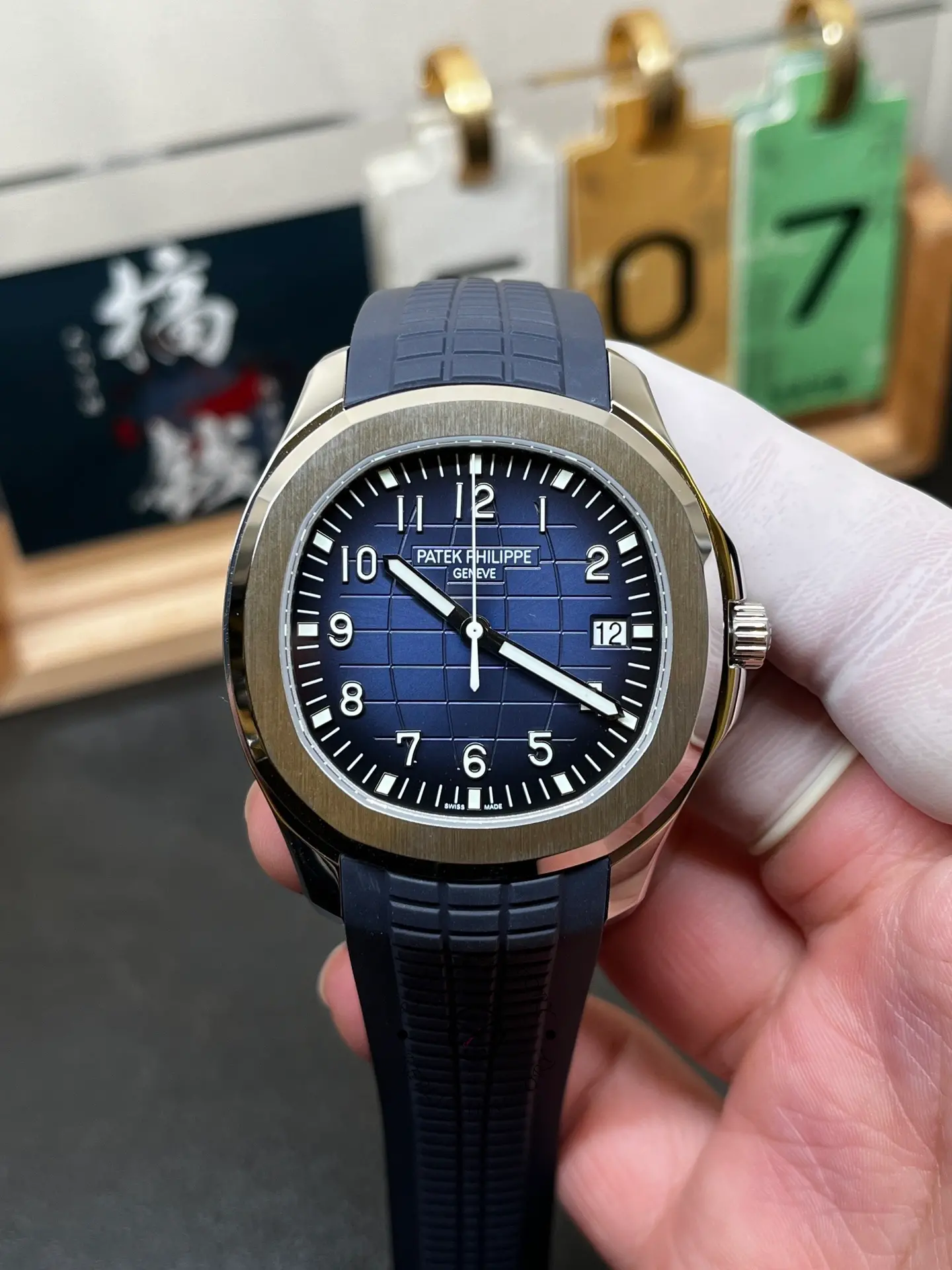 Front close-up of Patek Philippe Aquanaut 5168G-001 showing embossed dial texture and hands.