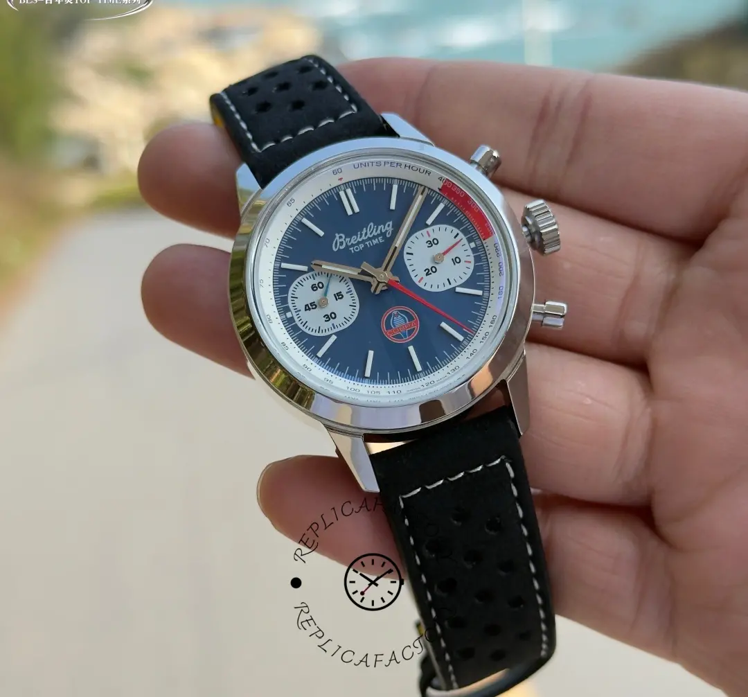 Breitling Top Time B01 Shelby Cobra AB01763A1C1X1, handheld wrist shot highlighting Arabic numerals and red accents.